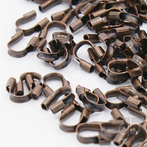 Protective eyelet for jewelery wire Old copper